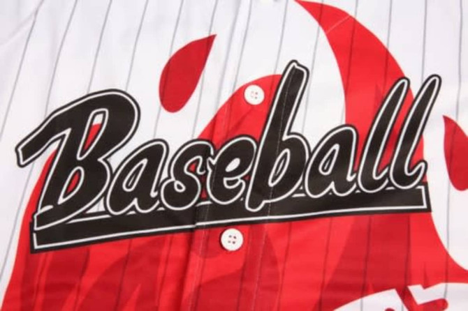 A white baseball uniform featuring red accents and a large black "Baseball" graphic, with a striped design and buttons.