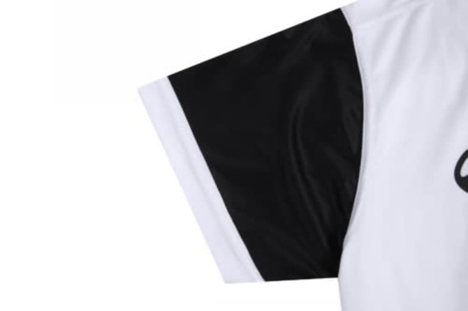 A sports jersey featuring a white body with a black sleeve. It has a logo on the front.
