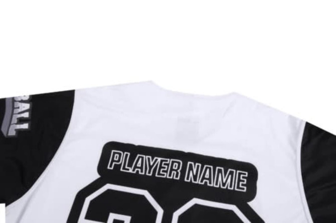 A sports jersey in black and white with a placeholder for a player name and a logo on the sleeve.