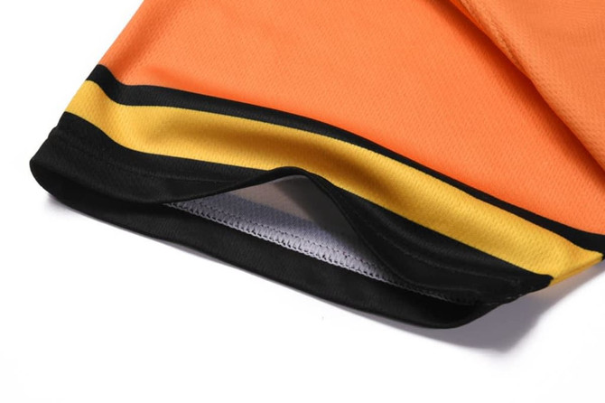 An orange baseball tee with black and yellow trim at the hem, featuring a full button closure.