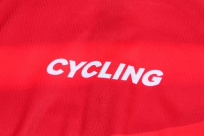 A vibrant red cycling jersey featuring a logo in white. Perfect for sports enthusiasts.