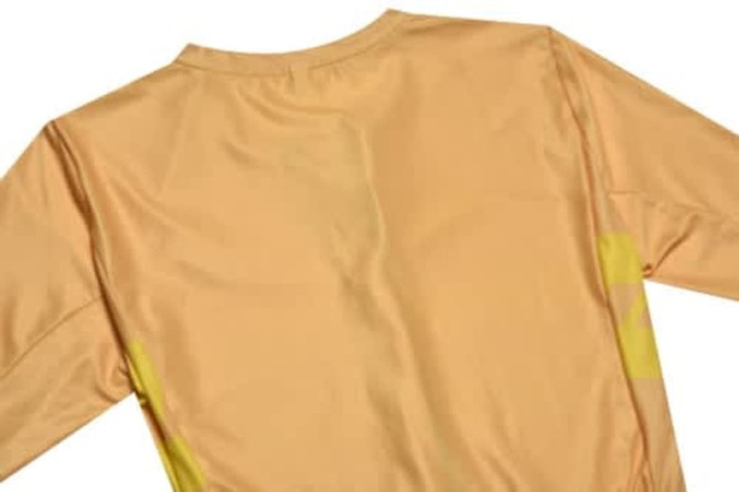 A yellow sports jersey with long sleeves, featuring a logo on the back.