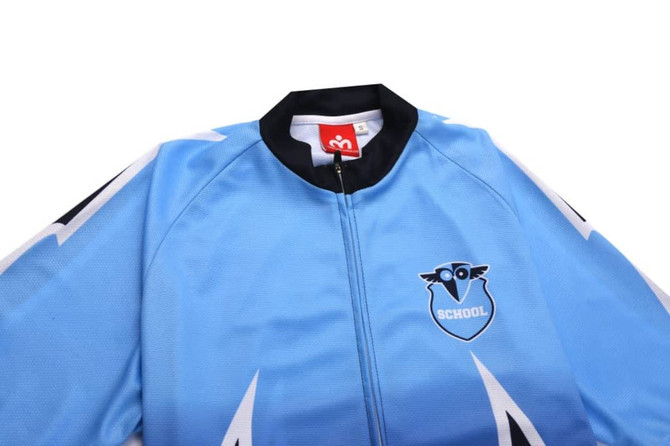 A blue cycling team wear tee featuring a black collar and a logo on the front.