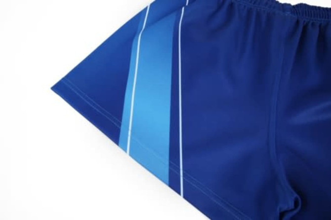 Blue sports shorts featuring blue and white stripes along the side, with an elastic waistband.
