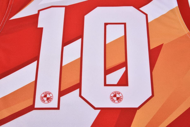 A red and orange Australian rules football jersey featuring the number 10 and a logo.