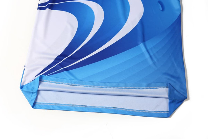 A blue lawn bowling uniform featuring a wave pattern, with a logo on the fabric.