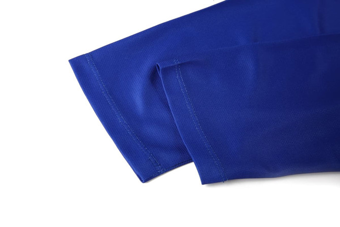 A blue lawn bowling uniform featuring sleeves with a smooth fabric texture and neat stitching.