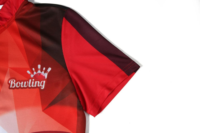 A red and black bowling team jersey featuring geometric designs and a logo on the sleeve.