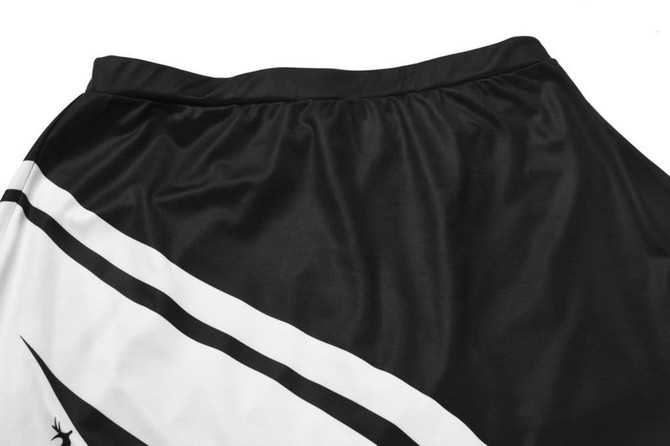 A black and white sports jersey featuring a sleek design and a logo on the fabric.