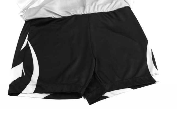 A black and white bowling team uniform featuring shorts with a distinctive pattern and an attached jersey.