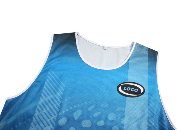 A blue Aboriginal singlet vest with a logo and a patterned design on the fabric.