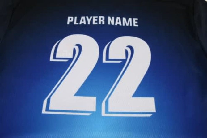 A blue soccer jersey featuring the number 22 and a space for a player's name, with a logo present.