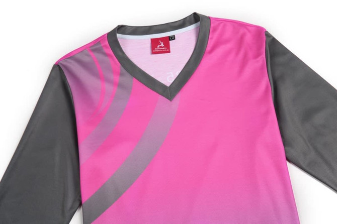 A pink and grey sports team t-shirt with a v-neck and a logo on the tag.