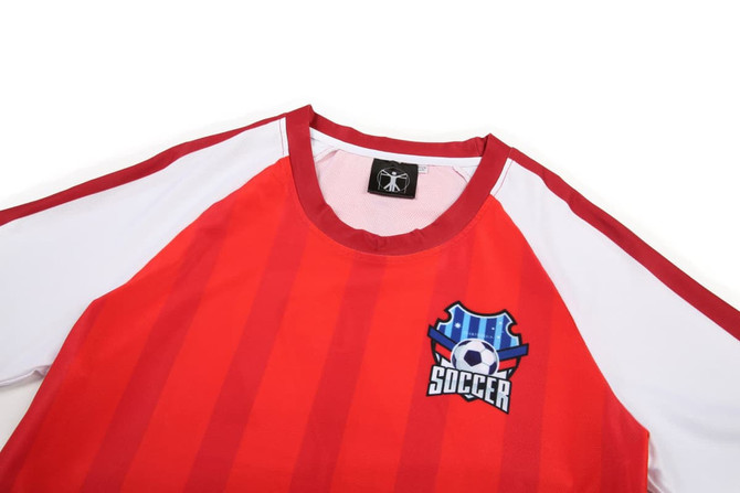 A red and white women's soccer uniform tee featuring stripes and a logo on the front.