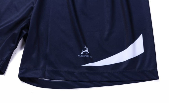 Navy shorts with a white design element and a logo on the lower leg. Ideal for custom sublimation printing.