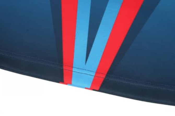 A navy sports jersey featuring red and blue striped designs and a logo. Ideal for rugby team wear.