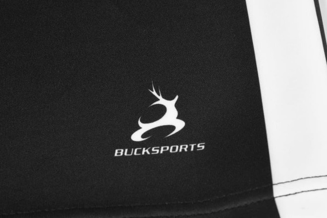 A pair of black rugby union shorts featuring a gusset crotch with a branding logo.