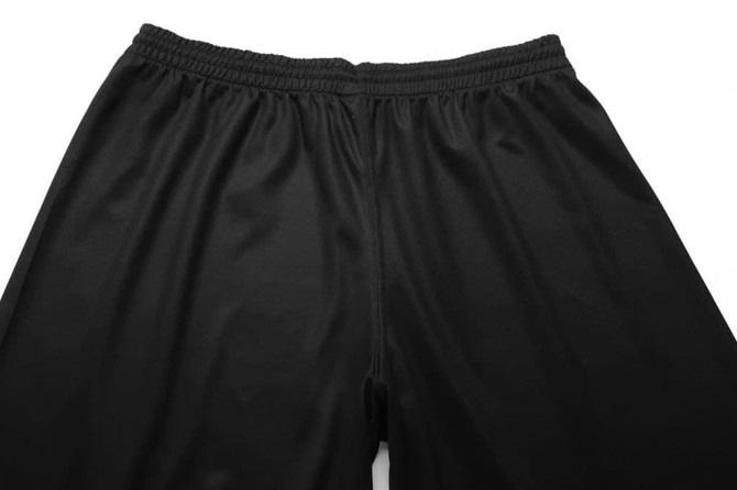 Black shorts featuring an elastic waistband, made of a smooth fabric. The image displays the top view of the garment.