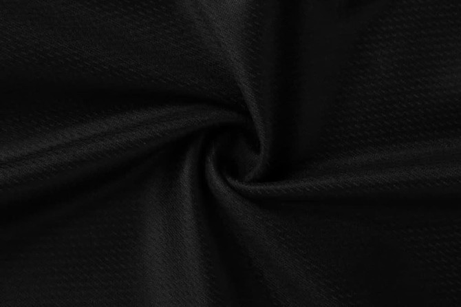 A fabric swirl in black, showcasing a smooth texture and subtle sheen. Features a solid, uniform colour with no patterns.