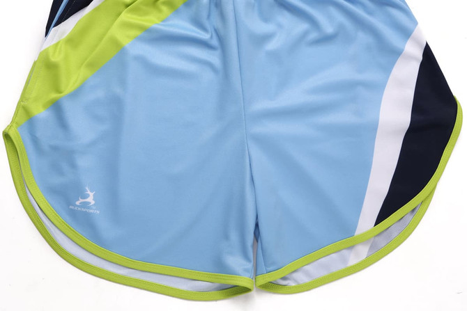 Athletics shorts in light blue, featuring a design with green and navy accents, and a logo on the side.