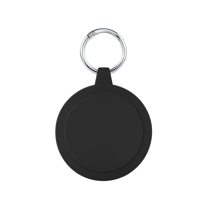 A round black keychain holder features a silver keyring. The surface is smooth with subtle grooves around the edge.