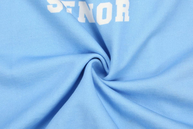 A light blue cotton fabric featuring direct printing. The material is soft and swirled in the image.