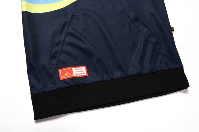 A navy blue hoodie featuring a pocket and a black hem. It includes a logo on a tag.