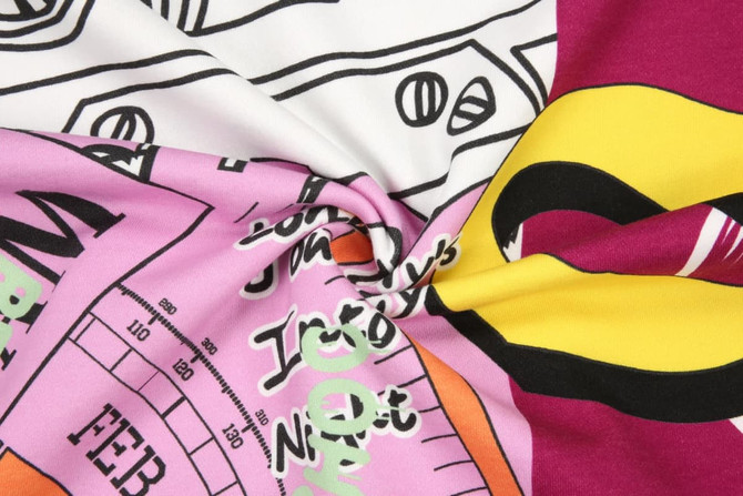A cotton hoodie fabric featuring a multicoloured, playful design with bold graphics and patterns.