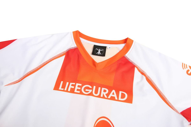 A lifeguard costume in white with orange accents and a prominent logo at the front.