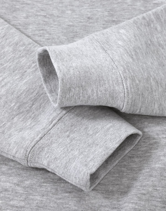 A grey crew fleece sweater featuring long sleeve cuffs and a soft texture, with a logo present.