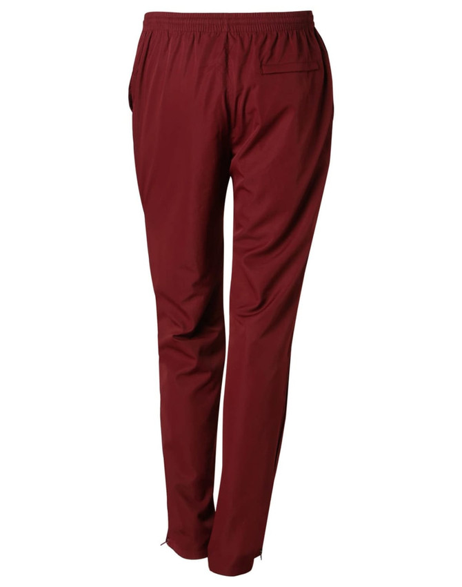 Maroon kid's track pants with an elastic waistband and pockets, featuring a logo on the back.