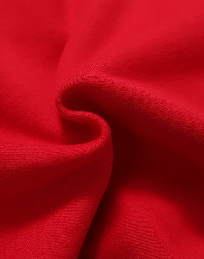 A close-up view of soft, red fleece fabric showing its textured surface. The image features a subtle fold in the material.