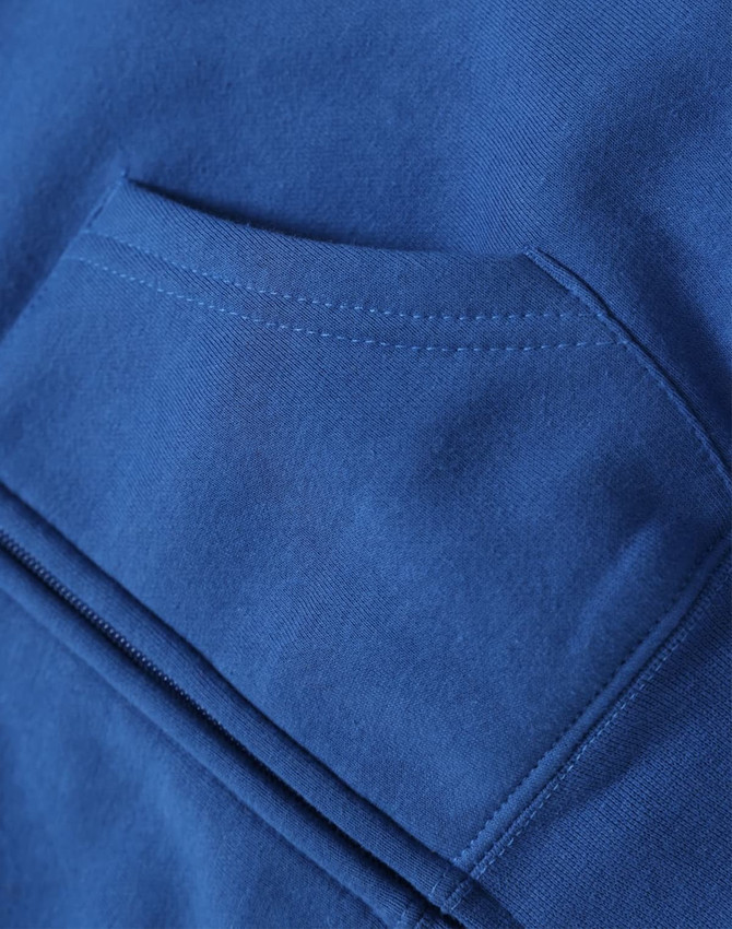 A blue full-zip fleecy hoodie featuring a front pocket and a smooth fabric texture. It includes a logo.