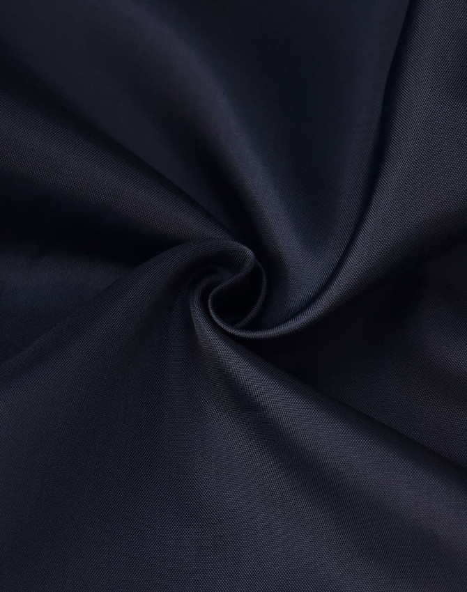A navy fabric with a smooth texture, showcasing a swirl pattern. The material appears durable and suitable for garments.