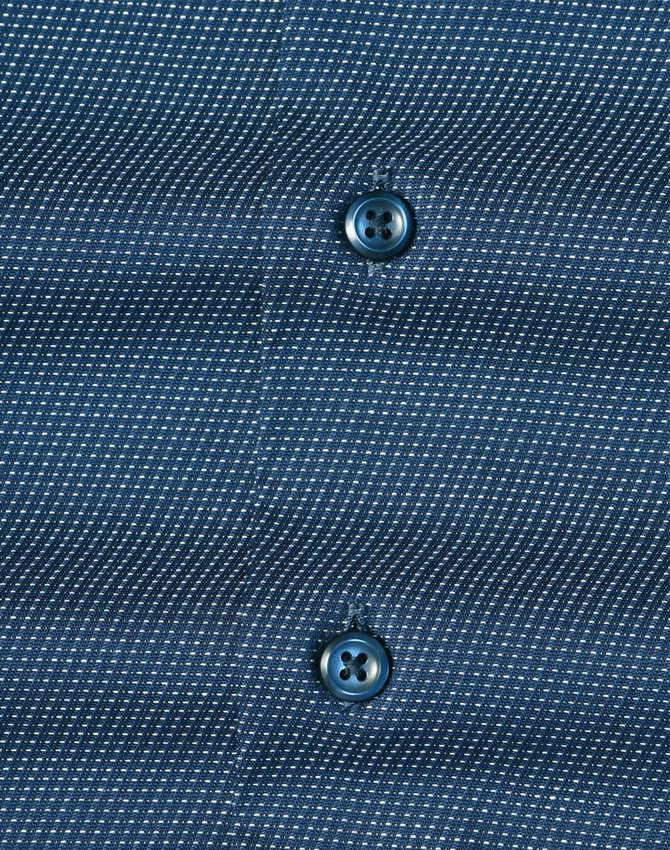 Men's long-sleeve button-up shirt in navy with a pin dot pattern and contrasting buttons. Features branding.