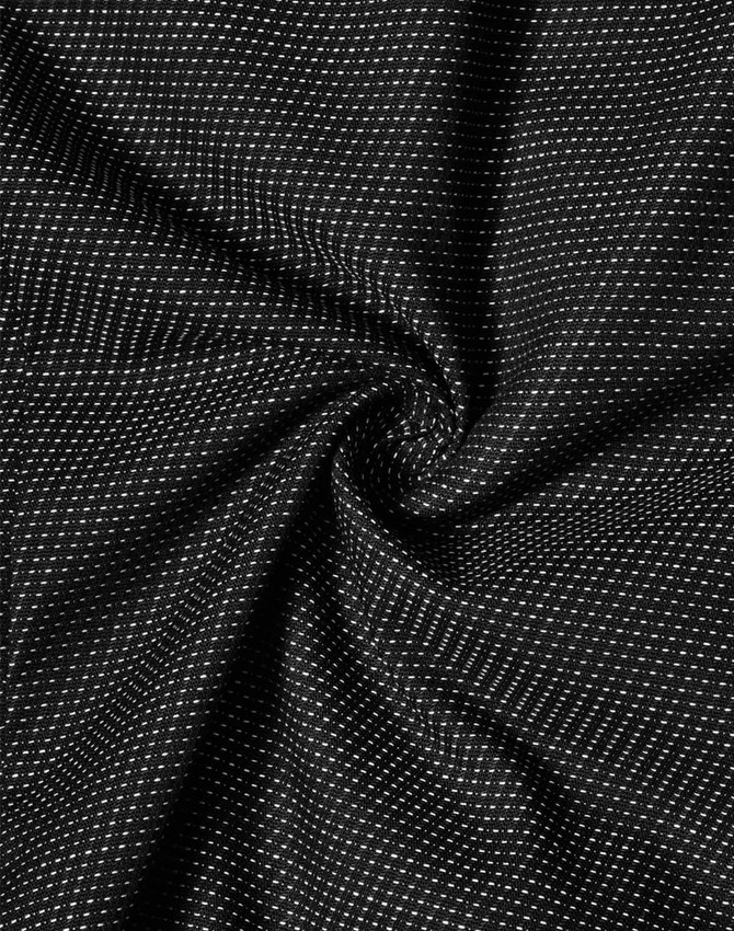 A close-up of a fabric with a black pin dot pattern, showcasing its texture and stretch. It features a logo.