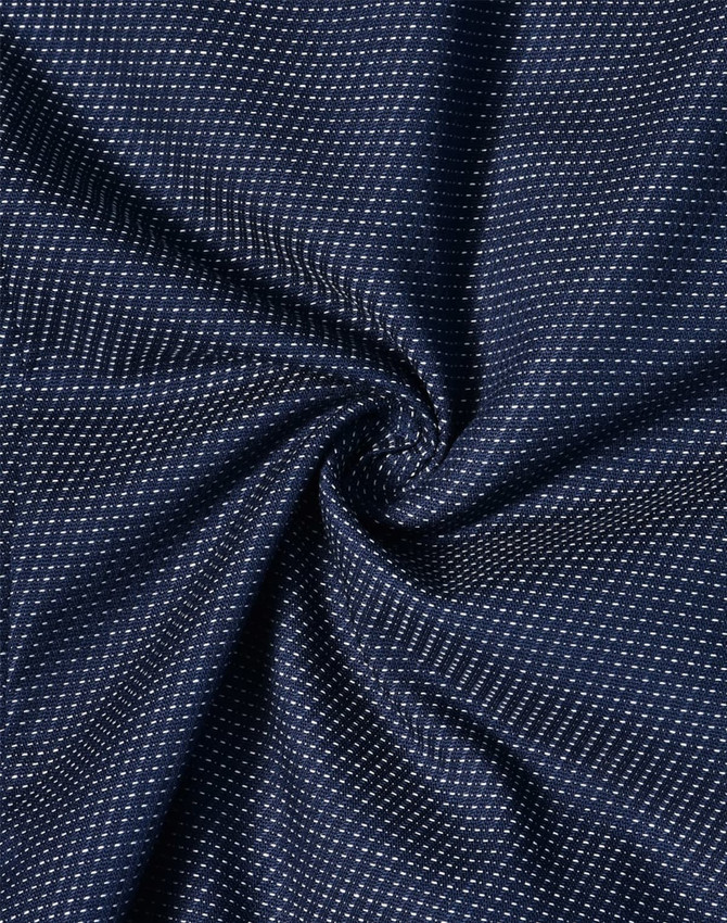 A navy blue fabric featuring a pin dot pattern, presenting a soft and stretchy texture. The fabric has a subtle sheen.