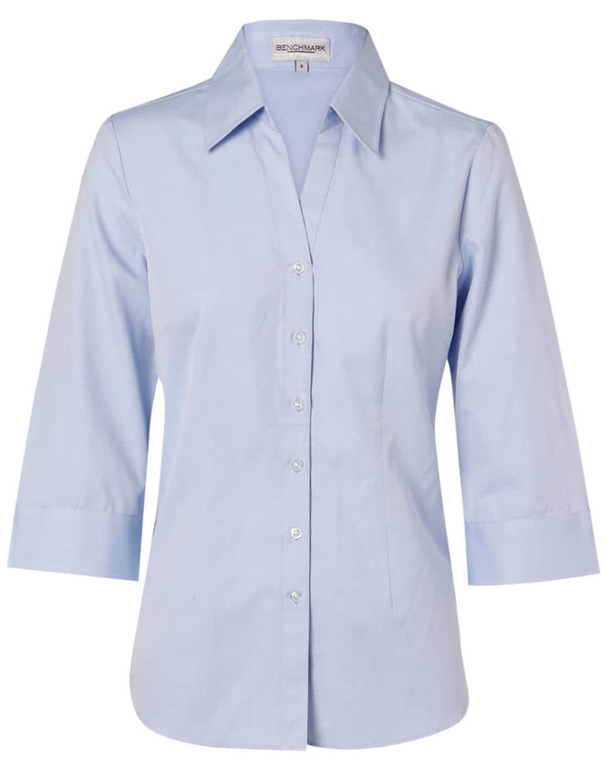 A light blue women's fine chambray shirt with 3/4 sleeves and a button-up front. Features a collar and a logo.