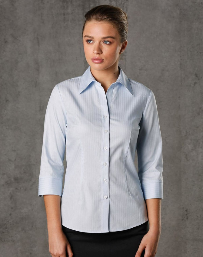 A light blue women's 3/4 sleeve button-up shirt with a self-stripe pattern and a logo.