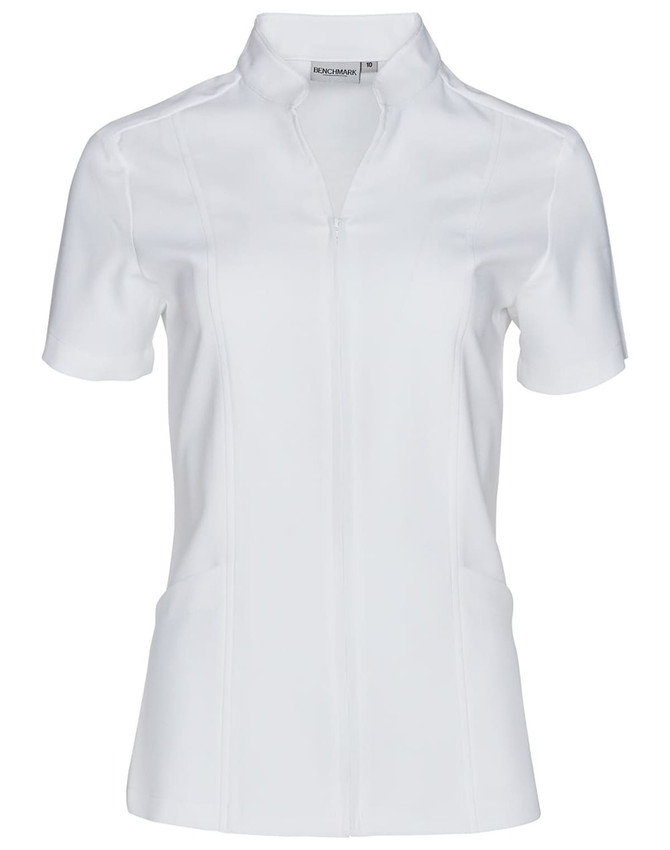 A white short sleeve tunic with a full zip front, featuring a fitted design and a logo.