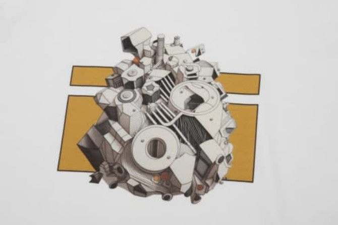 A graphic design featuring a detailed illustration of machinery in black and white against a yellow background on a white T-shirt.