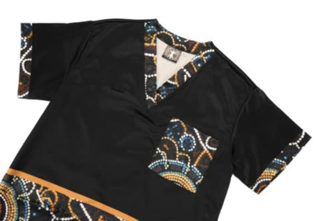 A black Hawaiian shirt featuring colourful patterned sleeves and a pocket, showcasing a vibrant design.