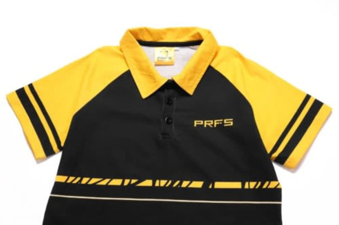 A black and yellow polo shirt featuring short sleeves, a collar, and a logo on the front.