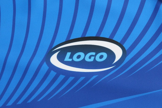 A blue fabric with dynamic stripes featuring a logo in the centre.