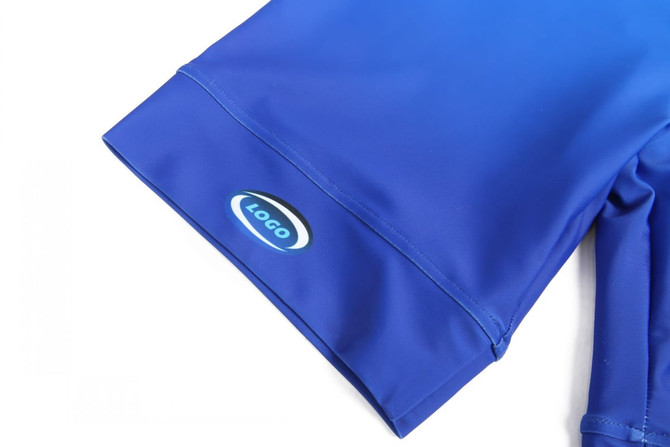 A blue athletics uniform tight featuring a logo on the side. The fabric is smooth and stretchy.