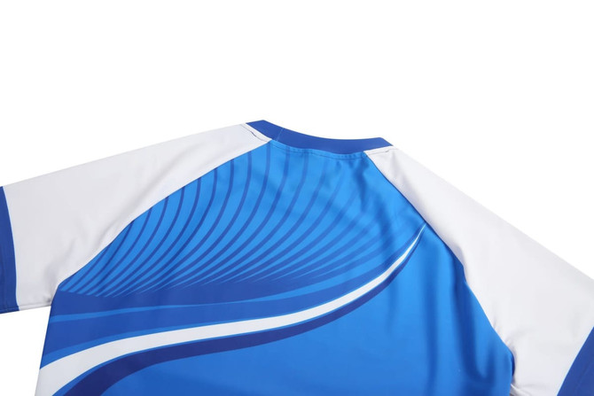 A blue and white tight-fitting t-shirt with dynamic wavy patterns and a logo on the back.
