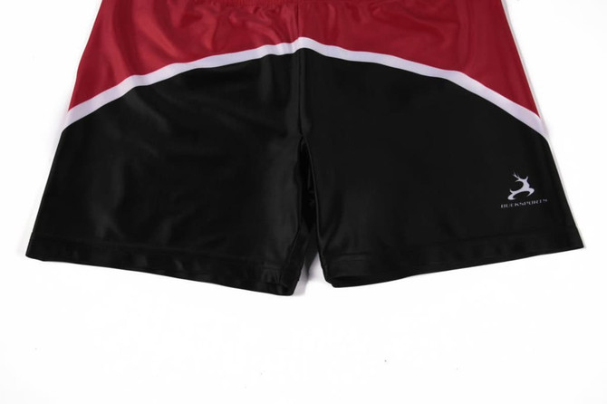 Red and black promotional shorts with a curved design and a small logo on the side.