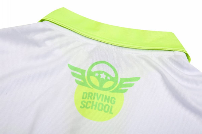 A white shirt with a neon green collar and a logo on the back featuring a circular design and wings.