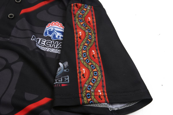 A black mechanic engineer uniform featuring a patterned sleeve with red and green decorative elements and a logo.