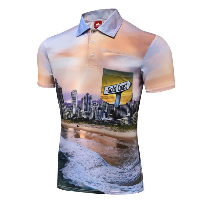 A short-sleeved polo shirt featuring a vibrant Gold Coast beach scene and a pocket design, predominantly in shades of blue and beige.